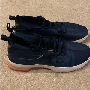 Under Armour Project Rock training shoes.